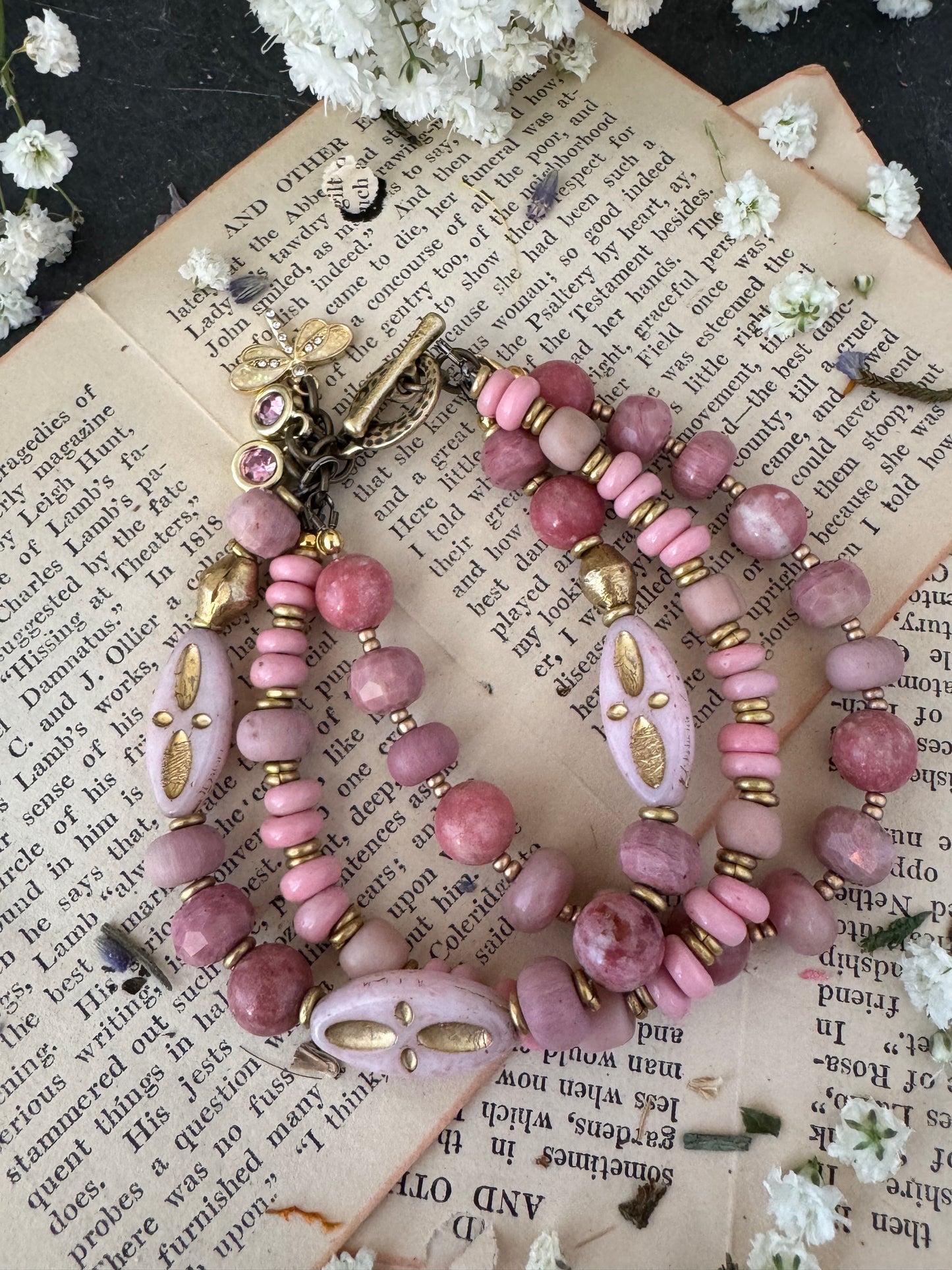 Pink Rhodonite, pink Indonesian glass, Czech glass, African brass, bracelet. Rhinestone, opal charms.