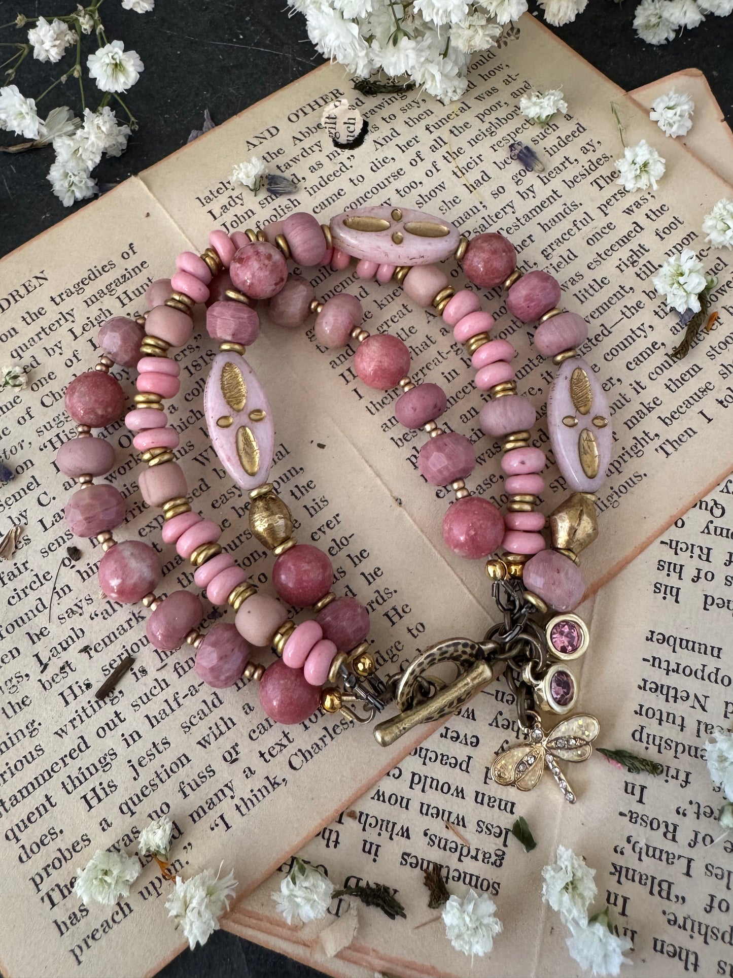 Pink Rhodonite, pink Indonesian glass, Czech glass, African brass, bracelet. Rhinestone, opal charms.