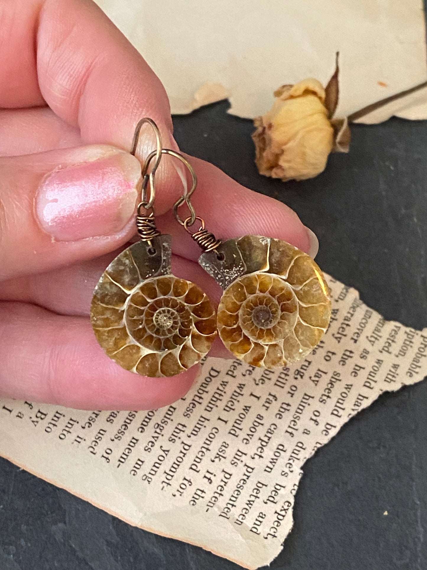 Ammonite stone, bronze metal earrings, jewelry.