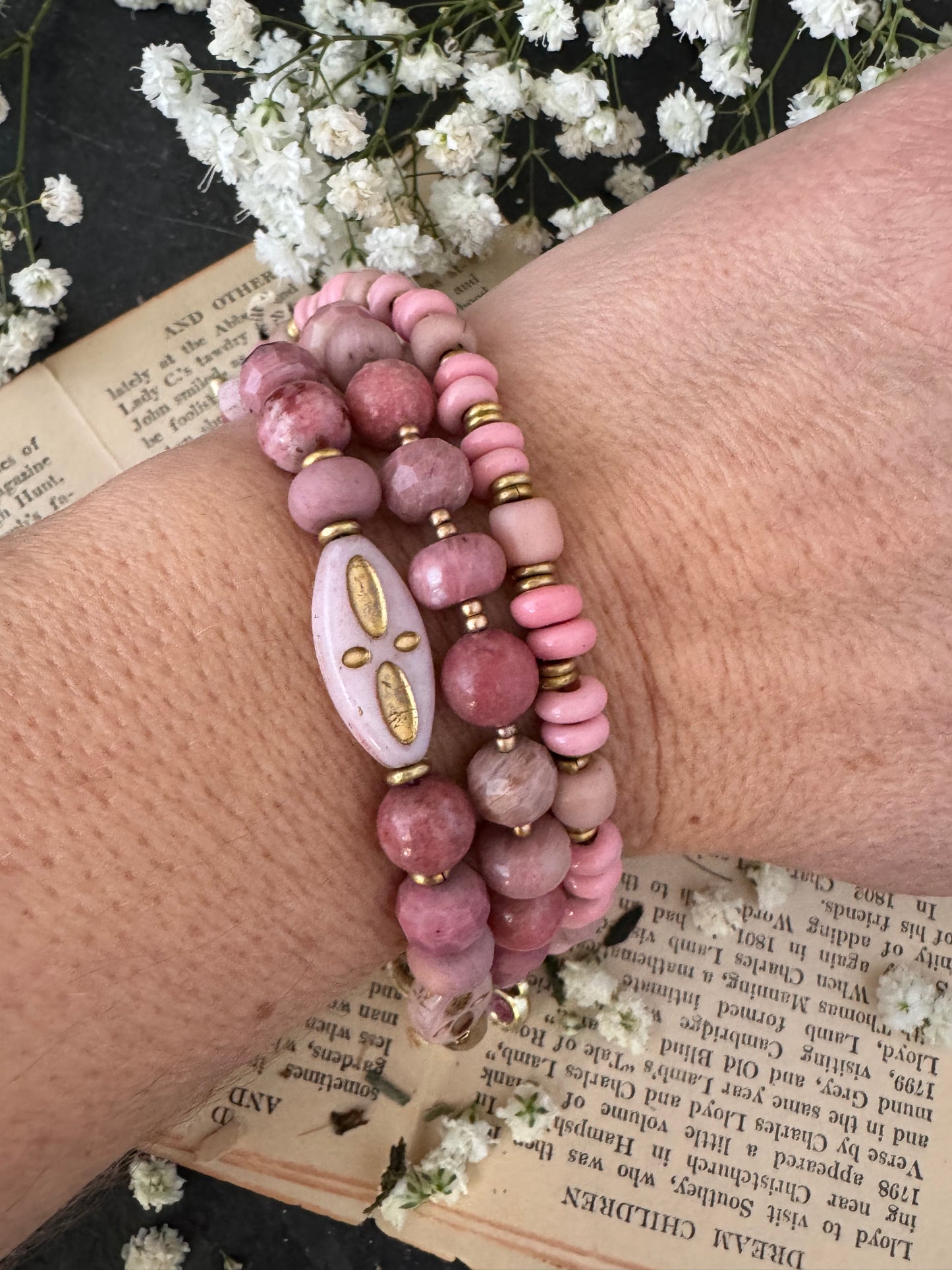 Pink Rhodonite, pink Indonesian glass, Czech glass, African brass, bracelet. Rhinestone, opal charms.