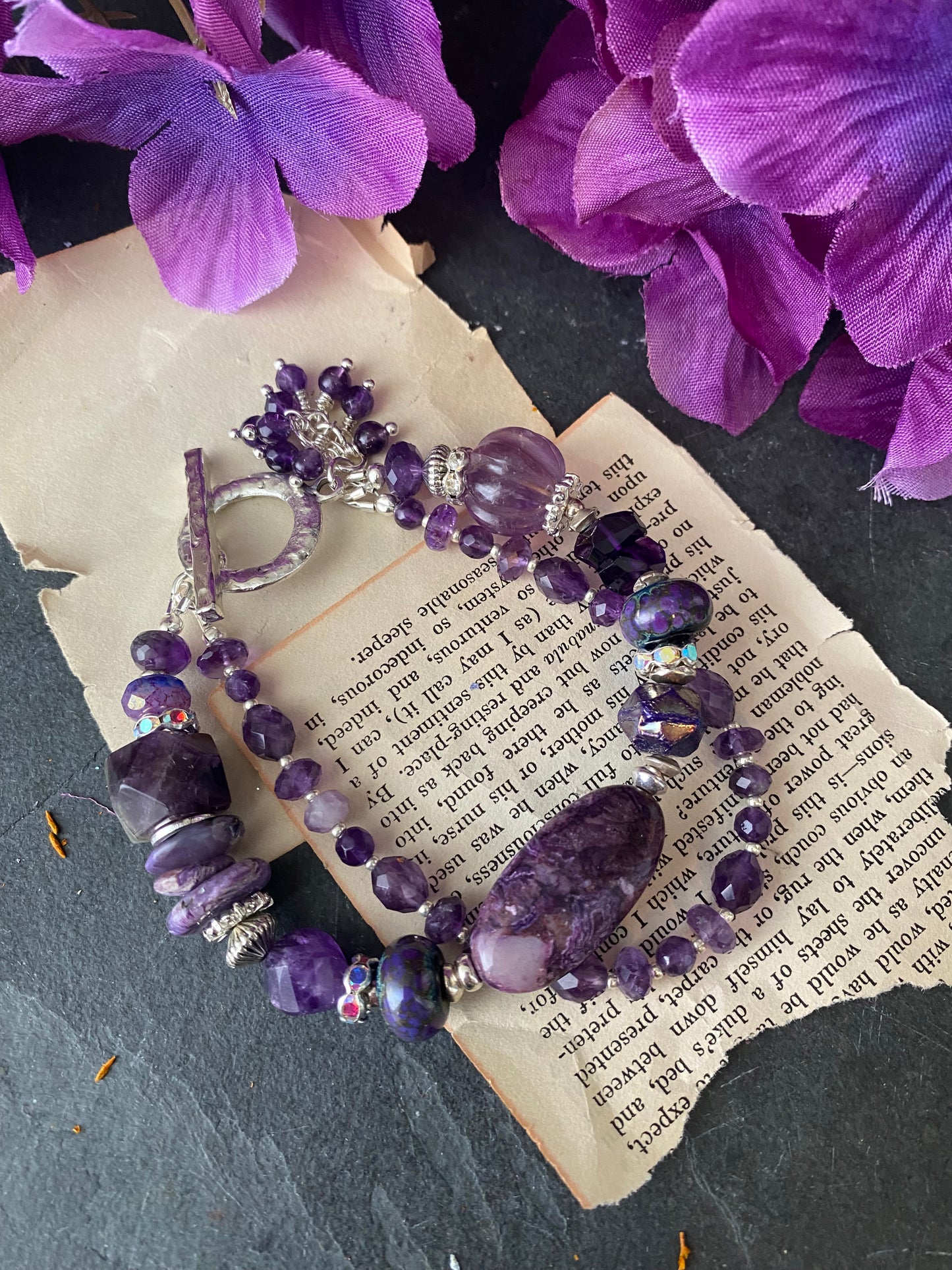 Amethyst gemstone, charoite stone, lampwork glass, silver metal, bracelet.