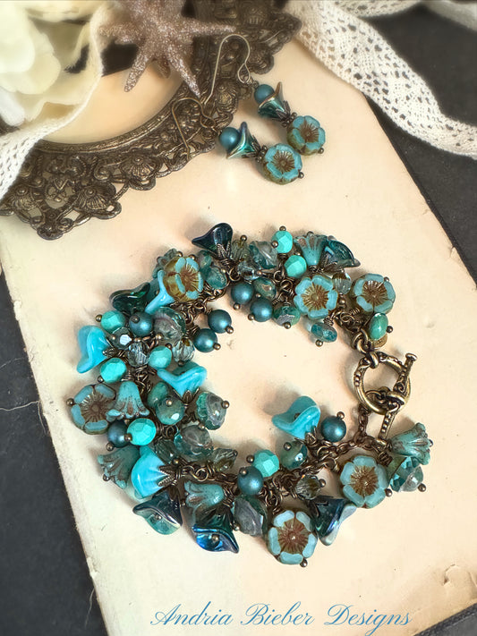 Teal flower bracelet. Czech glass, bronze metal bracelet.