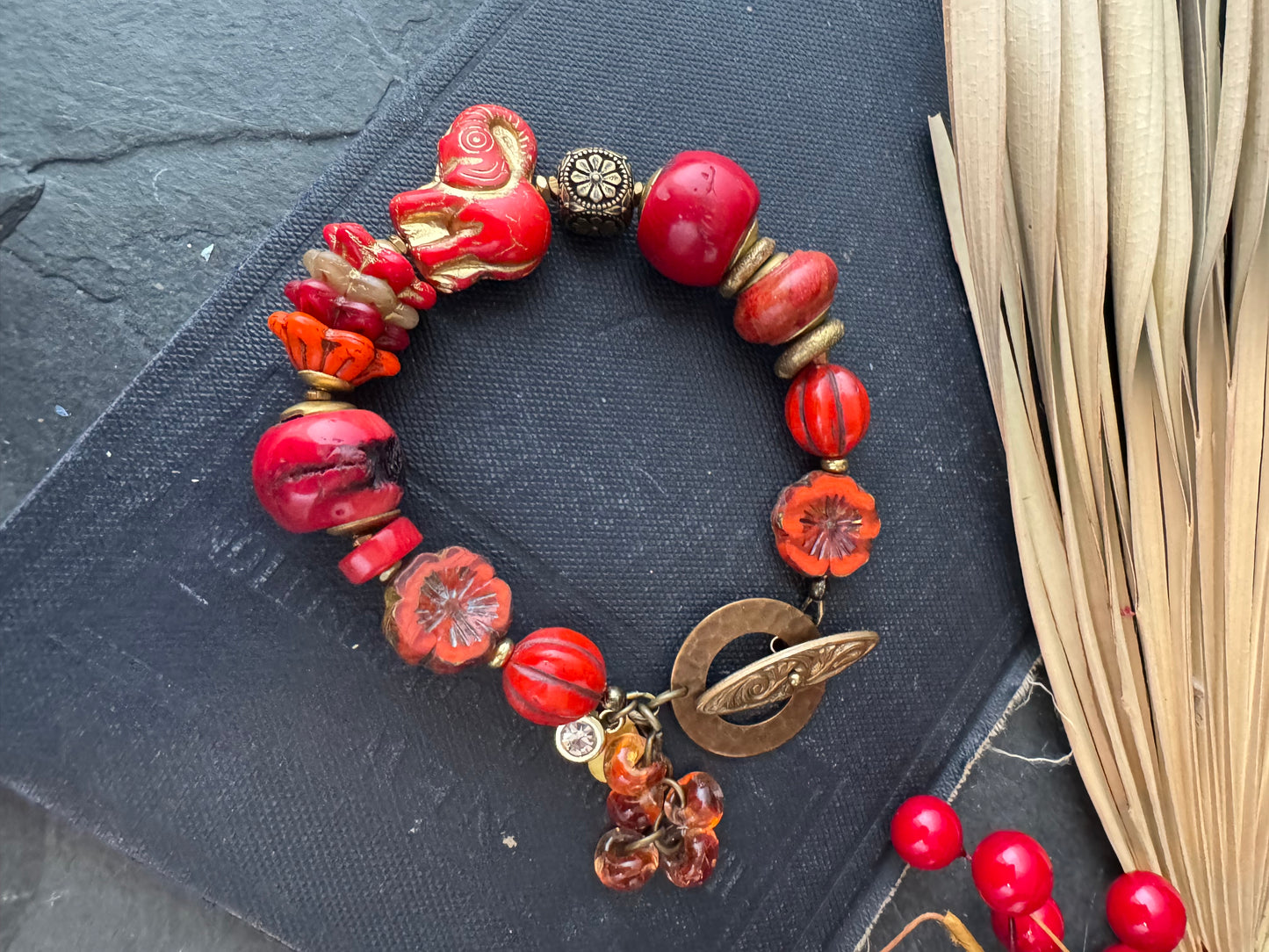 Red coral, czech glass, brass beads, button glass, bracelet.