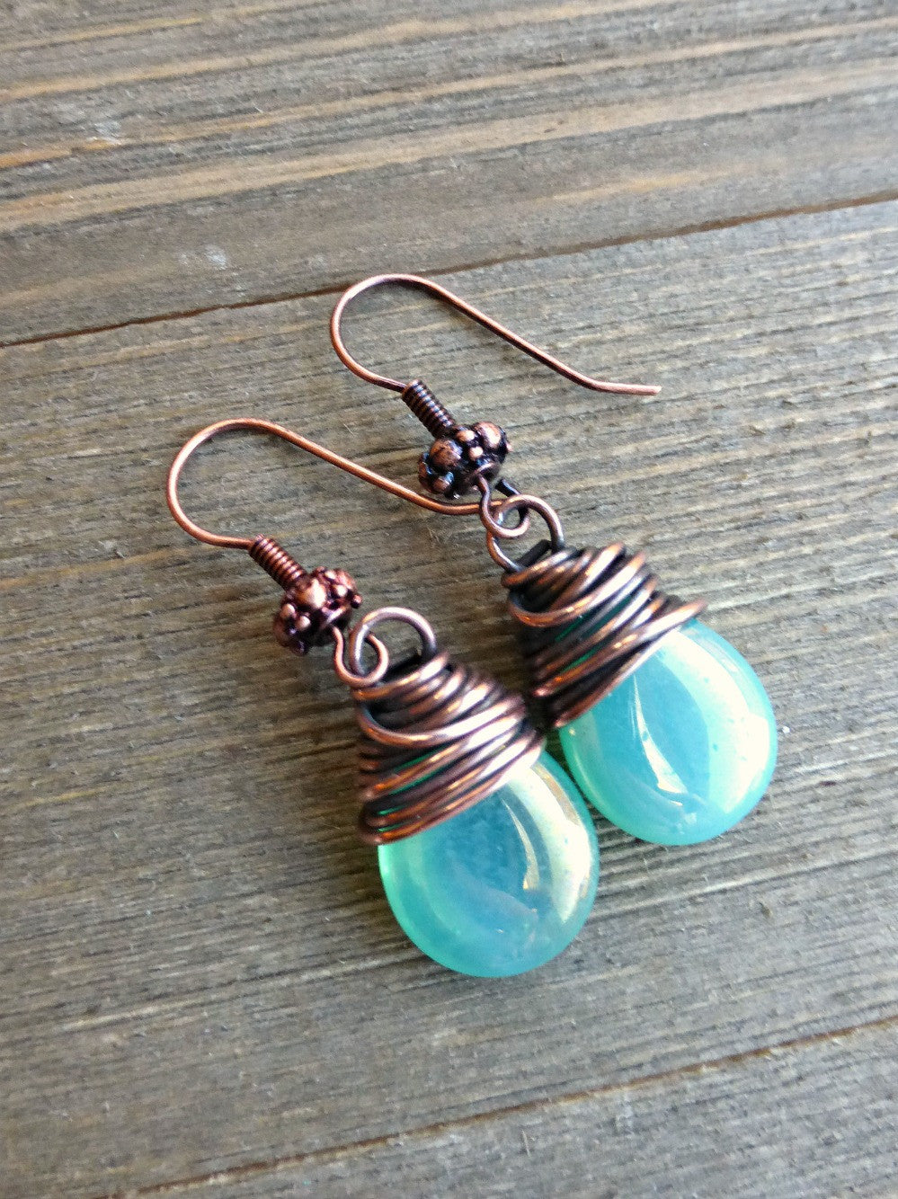 Teal green transparent Czech Picasso glass teardrop, copper wire wrapped earrings. - Andria Bieber Designs 